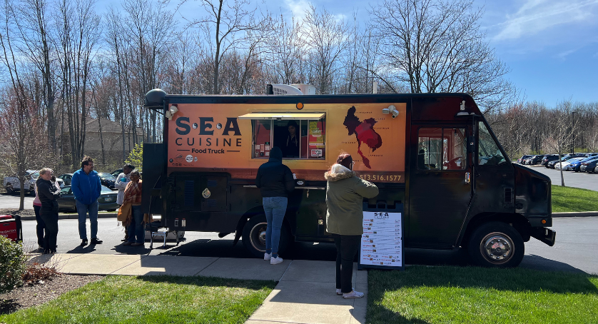 LCS employees standing in line for a food truck for lunch at the LCS office. 